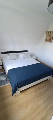 Łóżko lub łóżka w pokoju w obiekcie AP Apartment's Rodzinny