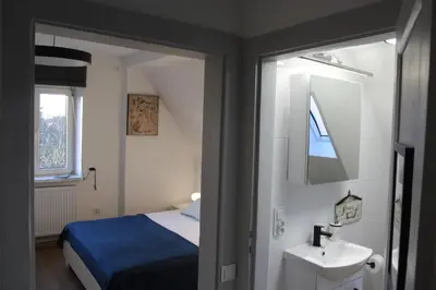 Łóżko lub łóżka w pokoju w obiekcie AP Apartment's Rodzinny
