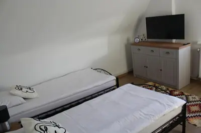 Łóżko lub łóżka w pokoju w obiekcie AP Apartment's Rodzinny