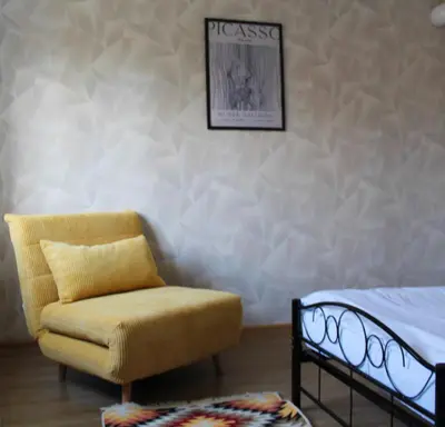 Łóżko lub łóżka w pokoju w obiekcie AP Apartment's Rodzinny