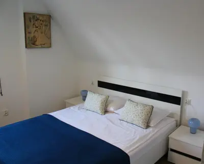 Łóżko lub łóżka w pokoju w obiekcie AP Apartment's Rodzinny