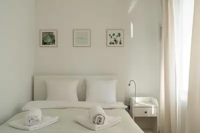Łóżko lub łóżka w pokoju w obiekcie RentPlanet - Apartament Stawowa