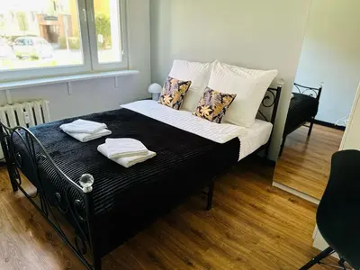 Łóżko lub łóżka w pokoju w obiekcie Apartament pod Książem