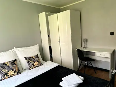 Łóżko lub łóżka w pokoju w obiekcie Apartament pod Książem