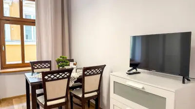 Telewizja i/lub zestaw kina domowego w obiekcie Cztery Kąty w Rynku by LibertaRent
