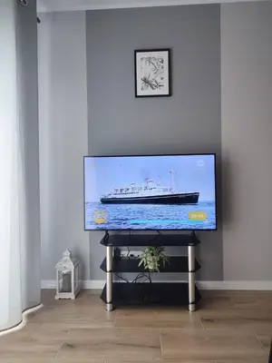 Telewizja i/lub zestaw kina domowego w obiekcie Apartament Happy