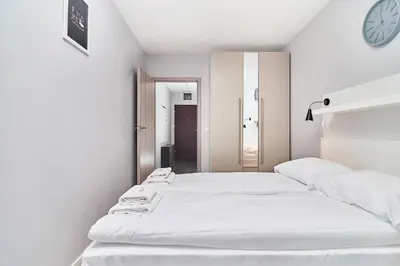 Łóżko lub łóżka w pokoju w obiekcie Apartment Świstackiego with FREE GARAGE by Noclegi Renters