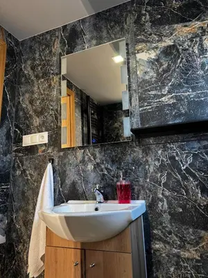 Łazienka w obiekcie Domki Nad Stawami z Jacuzzi i Sauną 4