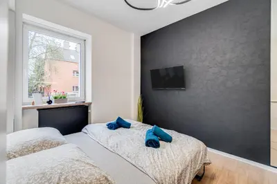 Łóżko lub łóżka w pokoju w obiekcie URBAN Nest