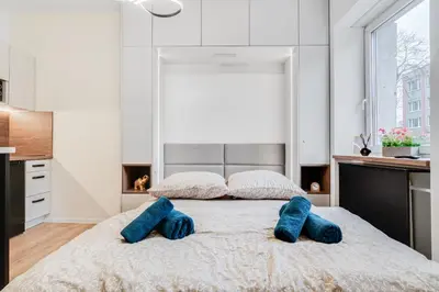 Łóżko lub łóżka w pokoju w obiekcie URBAN Nest