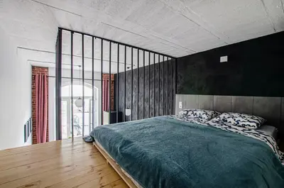 Łóżko lub łóżka w pokoju w obiekcie 4A Loft Apartment