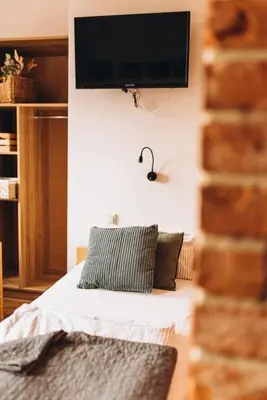 Łóżko lub łóżka w pokoju w obiekcie Villa Hubertus