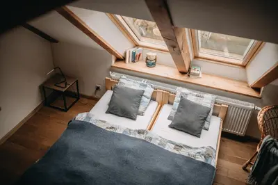 Łóżko lub łóżka w pokoju w obiekcie Villa Hubertus