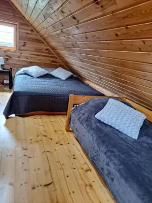 Łóżko lub łóżka w pokoju w obiekcie Domek letni