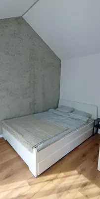 Łóżko lub łóżka w pokoju w obiekcie Domek Zając