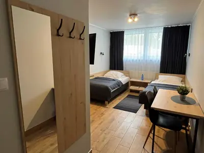 Łóżko lub łóżka w pokoju w obiekcie Hotel Leśny