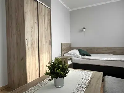 Łóżko lub łóżka w pokoju w obiekcie Hotel Leśny