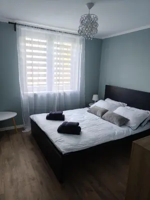 Łóżko lub łóżka w pokoju w obiekcie Kameralne Zacisze