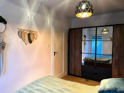 Łóżko lub łóżka w pokoju w obiekcie Apartament Urokliwy Zakątek Wałbrzych