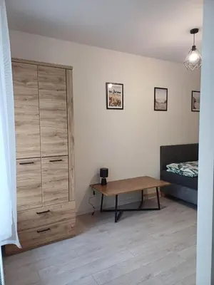 Łóżko lub łóżka w pokoju w obiekcie Apartament przy Armii Krajowej I