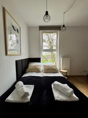 Łóżko lub łóżka w pokoju w obiekcie Apartament Kamionka Piast