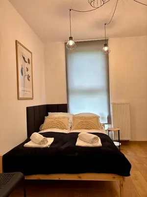 Łóżko lub łóżka w pokoju w obiekcie Apartament Kamionka Piast