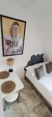 Łóżko lub łóżka w pokoju w obiekcie Mini AP Apartment's