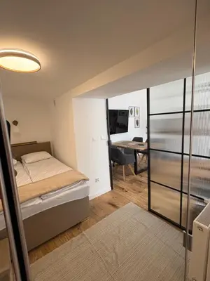 Łóżko lub łóżka w pokoju w obiekcie Apartamenty Toronto