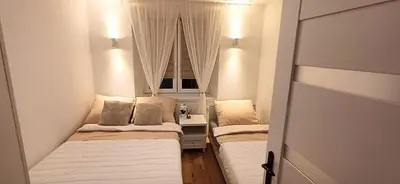 Łóżko lub łóżka w pokoju w obiekcie ApartamentStronieŚląskie