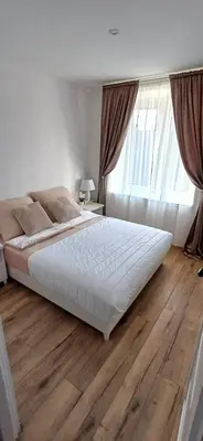 Łóżko lub łóżka w pokoju w obiekcie ApartamentStronieŚląskie