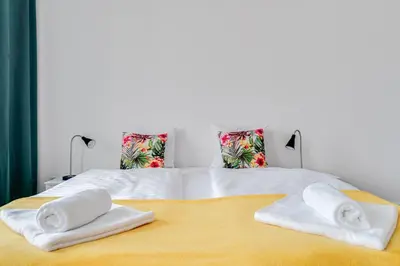 Łóżko lub łóżka w pokoju w obiekcie Jedności Narodowej 46 by Homeprime