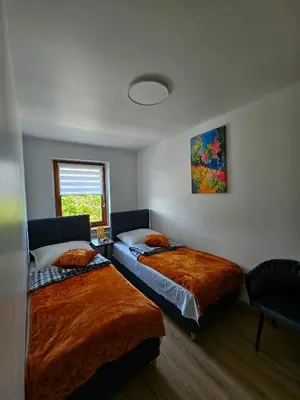 Łóżko lub łóżka w pokoju w obiekcie Apartament Radiostacja IX, parking free