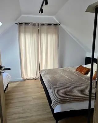 Łóżko lub łóżka w pokoju w obiekcie Górska Przystań Sierpnica dom Mała Sówka