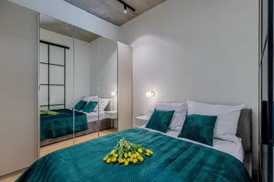 Łóżko lub łóżka w pokoju w obiekcie River Premium Apartment A