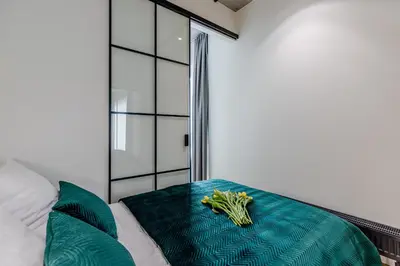 Łóżko lub łóżka w pokoju w obiekcie River Premium Apartment A