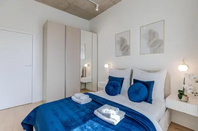Łóżko lub łóżka w pokoju w obiekcie River Premium Apartment B