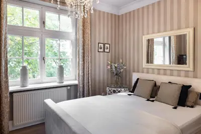 Łóżko lub łóżka w pokoju w obiekcie MAYA Home