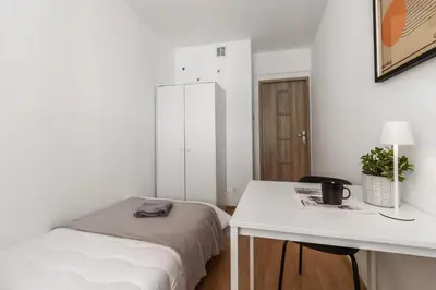 Łóżko lub łóżka w pokoju w obiekcie Old Town Rynek ul Więzienna