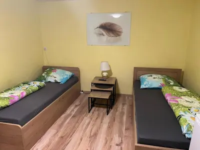 Łóżko lub łóżka w pokoju w obiekcie Trzy Pasma Pokoje Gościnne