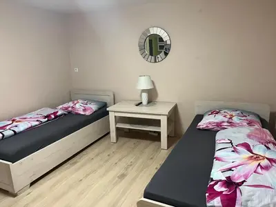 Łóżko lub łóżka w pokoju w obiekcie Trzy Pasma Pokoje Gościnne