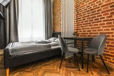Łóżko lub łóżka w pokoju w obiekcie Wyjątkowe Gniazdko w Sercu Wrocławia