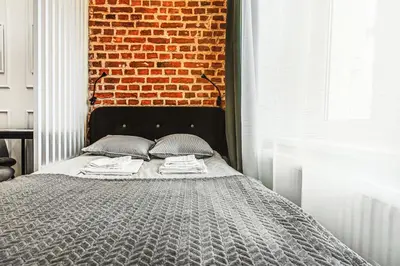 Łóżko lub łóżka w pokoju w obiekcie Wyjątkowe Gniazdko w Sercu Wrocławia