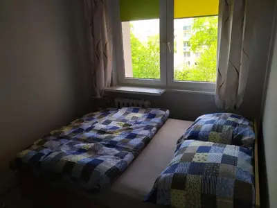 Łóżko lub łóżka w pokoju w obiekcie Apartament Raven