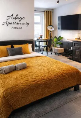 Łóżko lub łóżka w pokoju w obiekcie Adago Apartamenty Antracyt Szczawno-Zdrój - Luksusowy Apartament Premium - Nowoczesny Design - Blisko Parku Zdrojowego