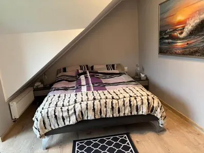 Łóżko lub łóżka w pokoju w obiekcie Apartament Natura - Dolina Baryczy