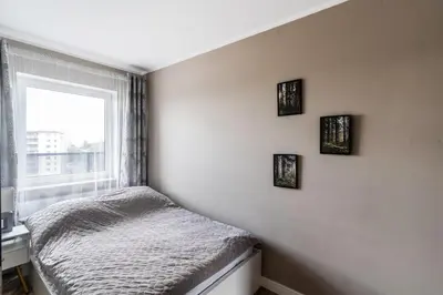 Łóżko lub łóżka w pokoju w obiekcie Apartament z tarasem i miejscem postojowym