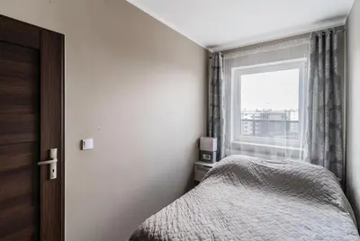 Łóżko lub łóżka w pokoju w obiekcie Apartament z tarasem i miejscem postojowym