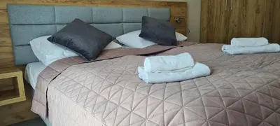 Łóżko lub łóżka w pokoju w obiekcie Aparthotel Apartamenty Czarna Góra 134