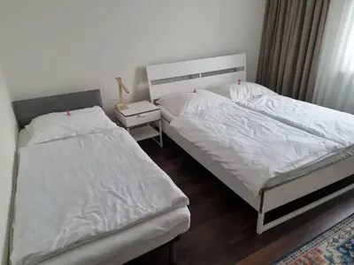 Łóżko lub łóżka w pokoju w obiekcie Orzechowy Dom