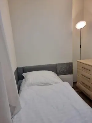 Łóżko lub łóżka w pokoju w obiekcie Orzechowy Dom